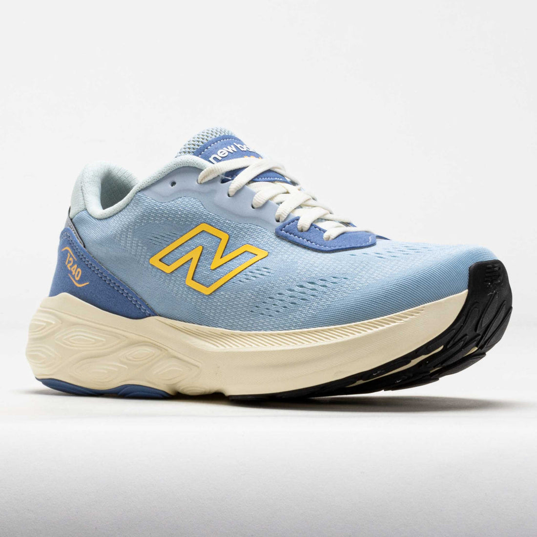 Blue running shoe with yellow logo on a light gray background